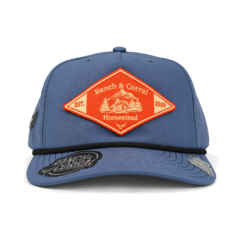 Gorra Ranch & Corral Homestead azul con parche naranja, vista frontal. SKU 7506136302511.